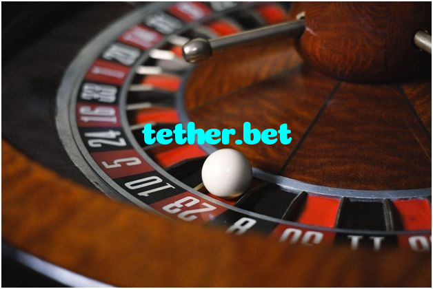 tether.bet casino presented on mobile device in Pakistan with slots and live games